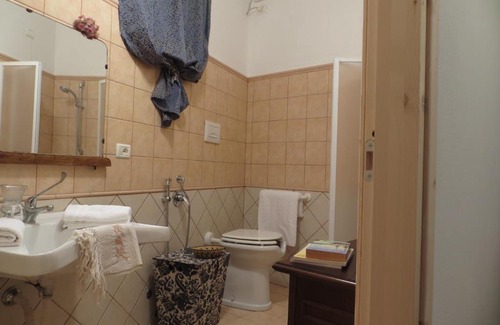 Baratili San Pietro Apartment | Inviting Casa Elvira with Kitchen Amenities for Your Stay