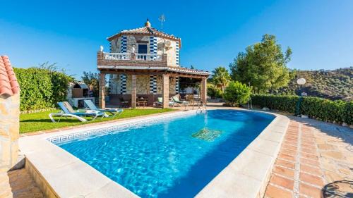 Iznate Villa | Inviting Casa La Noria Iznate: Poolside Family Retreat