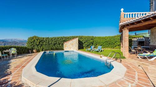 Iznate Villa | Inviting Casa La Noria Iznate: Poolside Family Retreat