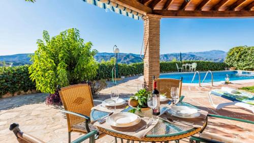 Iznate Villa | Inviting Casa La Noria Iznate: Poolside Family Retreat