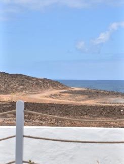La Santa House | Cozy Casa Los Lajares: Oceanfront Escape with Top Reviews