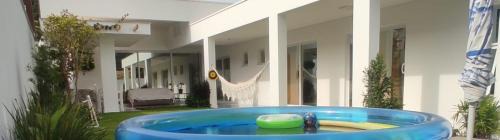Barra House | Experience Casa na Praia: Family-Friendly Retreat with Pool