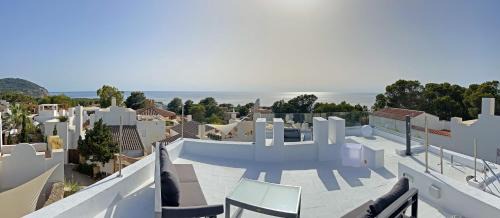 Sant Josep de sa Talaia Villa | Discover Casa Palm Tree: Oceanfront Oasis for Families