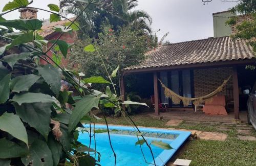 Garopaba House | Discover Casa Rústica: Poolside Stay Near Praia da Ferrugem