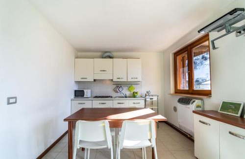 Lizzola Apartment | Casa Smile: Breathtaking Views & Family-Friendly Amenities