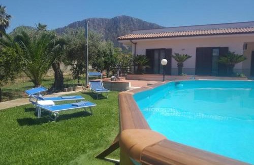 Villa Grazia di Carini House | Experience Casa Vacanze Caruso with Oceanfront Pool Views