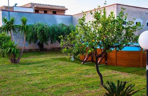 Villa Grazia di Carini House | Experience Casa Vacanze Caruso with Oceanfront Pool Views
