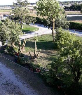 Nettuno Apartment | Idyllic Casa Vacanze nel Verde: Family-Friendly Retreat