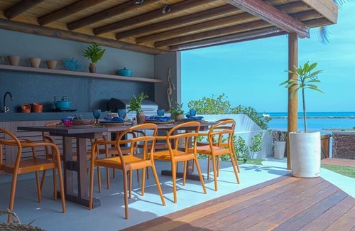 Barra de Sao Miguel House | CasaB standing on the sand in Barra.