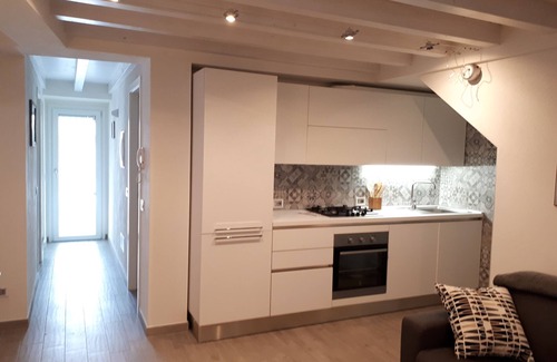 Peschiera Maraglio Apartment | Casadin: Prime Location Near Lake with Family-Friendly Amenities