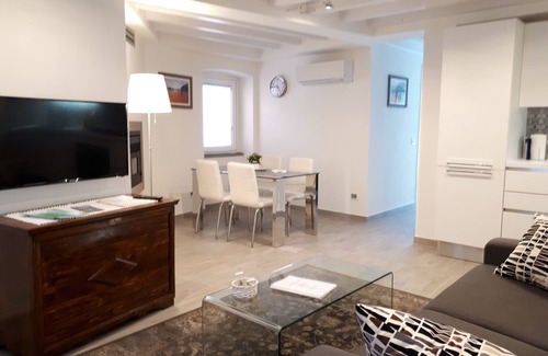 Peschiera Maraglio Apartment | Casadin: Prime Location Near Lake with Family-Friendly Amenities
