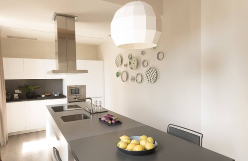 Gracia Apartment | Elegant Casagrand Suites: 4-Star Stay with Ocean Views
