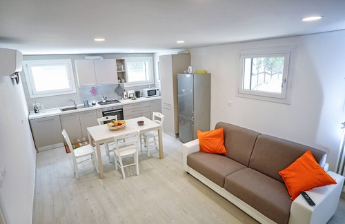 Santa Maria in Stelle Apartment | CasaLella: A Restored Family Workshop with Ocean View Amenities