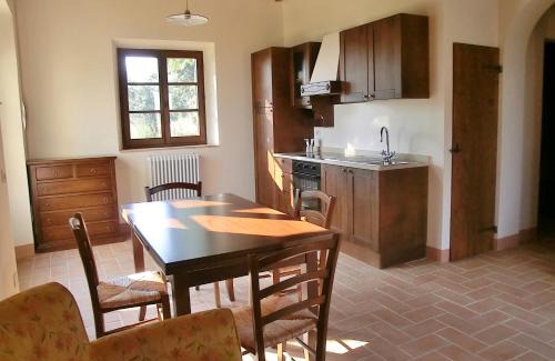 Sant'Angelo In Colle Apartment | Elegant Castel Brunello: Oceanfront Escape with Pool Access