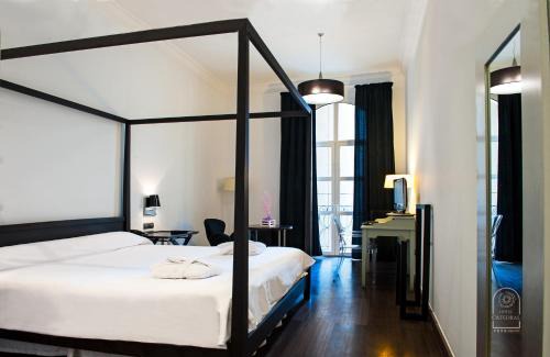 Almeria Centro Hotel | Elegant Catedral Almería: Poolside with Ocean Views