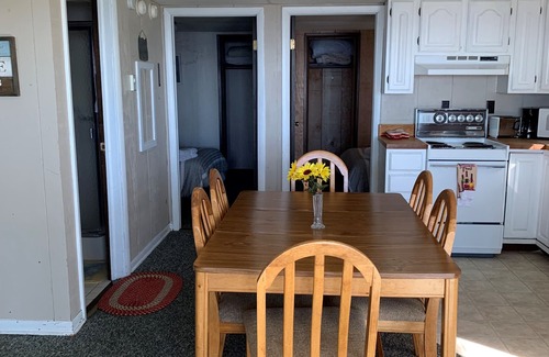 Prudenville Cottage | Relaxing Cedar Oaks Lakeside Resort with Lake Views