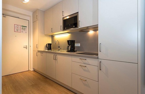 Langeoog Apartment | Central Apartment with Sunny Terrace, Steps from the Beach