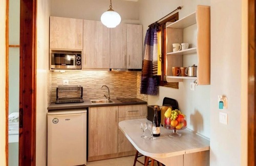 Roda Apartment | Central apartments amidst flower gardens with pool access, 120m from the beach