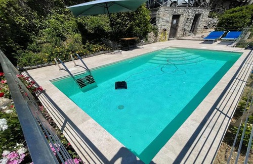 Spoleto House | Cozy Cerro Cottage: Family-Friendly Stay with Pool Access