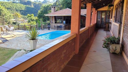 Bueno Brandao House | Idyllic Chácara Alto do Vale: Oceanfront Retreat for Families