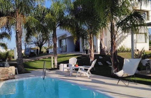 Chajari Apartment | Relax at Chajari Suites: Oceanfront Pool & Family-Friendly