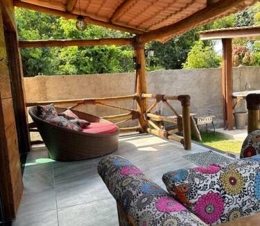 Armacao do Tairu House | Wooden Chalet Steps from the Sea with Cozy Fireplace