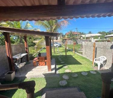 Armacao do Tairu House | Wooden Chalet Steps from the Sea with Cozy Fireplace
