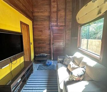 Armacao do Tairu House | Wooden Chalet Steps from the Sea with Cozy Fireplace