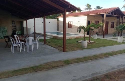 Paracuru House | Relax at Chalé dos Coqueiros: Oceanfront & Pet-Friendly Stay