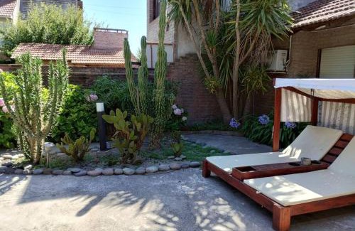 Punta Mogotes House | Cozy Chalé with Quincho and Park for Family Getaways