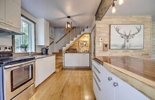 Saint-Jean-de-Matha Ski Chalet | Chalet Blanc: Waterfront Retreat with Spa and Adventure