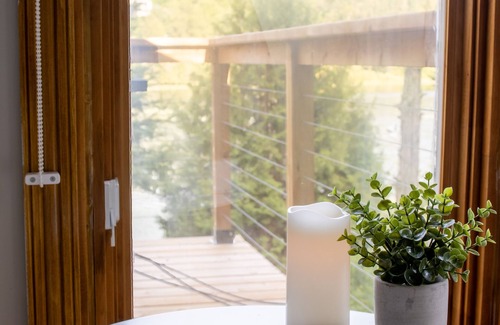 Saint-Calixte Ski Chalet | Relax at Chalet De Mama: Jacuzzi with Scenic Lake Views