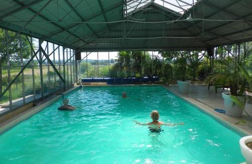Saint-Antoine-de-Breuilh Ski Chalet | Eco-Friendly Chalet with Pool and Child-Focused Amenities