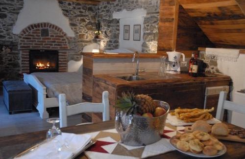 Inverso Pinasca Apartment | Cozy Stone and Wood Chalet with Fireplace & Family Amenities