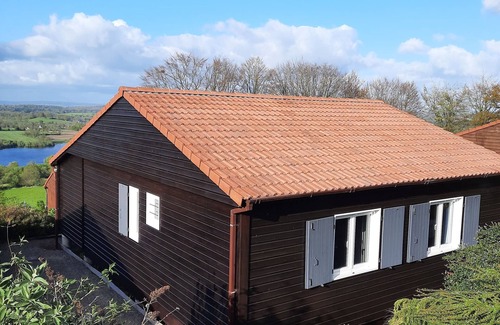 Saint-Germain-de-Tallevende-la-Lande-Vaumont Ski Chalet | Chalet N°70 fully equipped with view of Lac de la Dathée