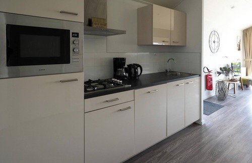 Municipality of Stede Broec House | Scenic Waterfront Chalet with Terrace & Family Amenities
