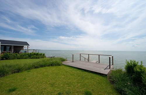 Municipality of Stede Broec House | Scenic Waterfront Chalet with Terrace & Family Amenities