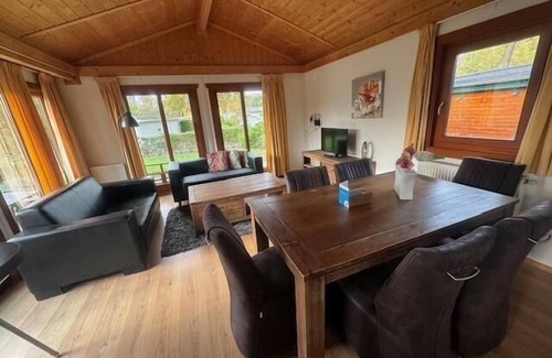 Susteren House | Cozy Chalet with Terrace: Family and Pet Friendly Escape