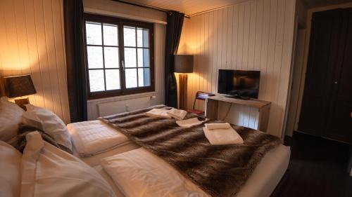 Champoussin Hotel | Discover Champoussin Lodge: Pool, Spa & Family Friendly