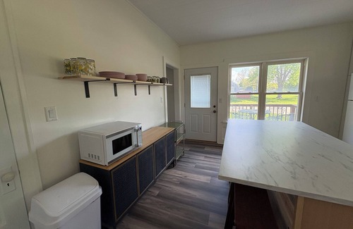 Lake Mills House | Charming 1900 home with furnished kitchen and king bed