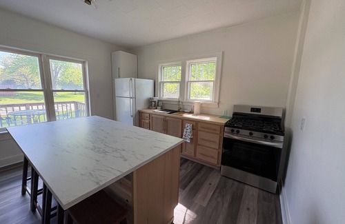 Lake Mills House | Charming 1900 home with furnished kitchen and king bed