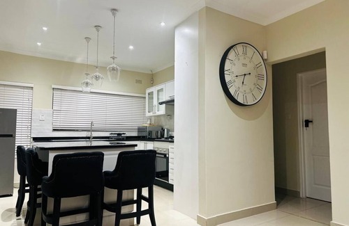 Harare House | Charming 2-bedroom house in peaceful Harare with a Pool ,AC, WiFi & fitness room