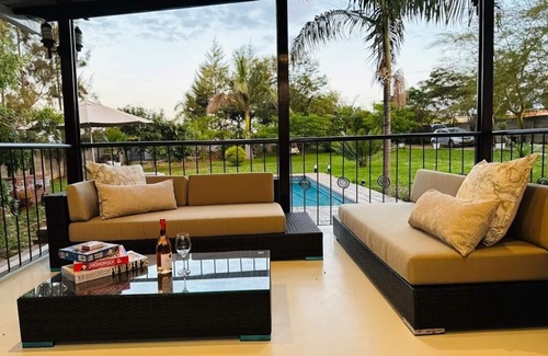 Harare House | Charming 2-bedroom house in peaceful Harare with a Pool ,AC, WiFi & fitness room