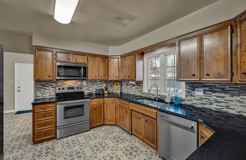 Topeka House | Family-Friendly 3BR Home with Private Deck and Yard