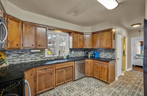 Topeka House | Family-Friendly 3BR Home with Private Deck and Yard