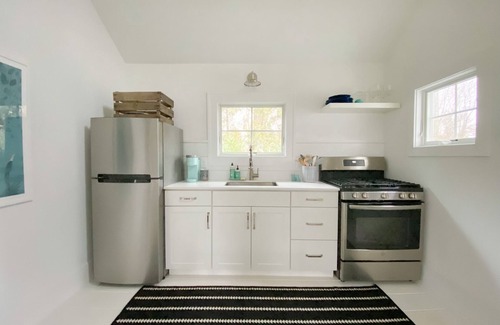 East Quogue Cottage | Welcoming Cottage with Salt Water Pool and Breakfast