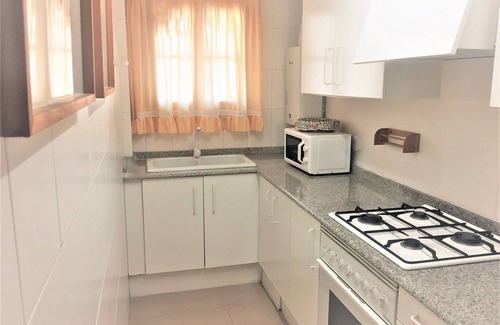 Port Saplaya Apartment | Cozy Ocean View Apartment with Pool & Kitchen Amenities