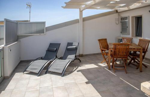 Punta Secca Apartment | Seaside Apartment in Punta Secca with Child-Friendly Perks