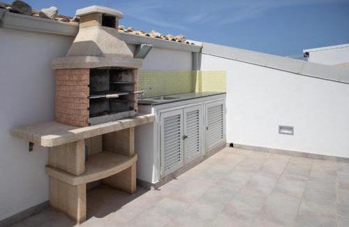 Punta Secca Apartment | Seaside Apartment in Punta Secca with Child-Friendly Perks