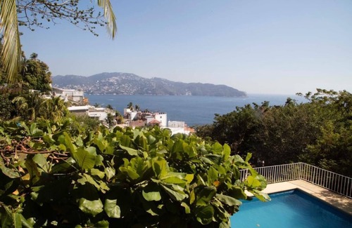 Caleta Condo | Trendy Condo Retreat in Vibrant Acapulco